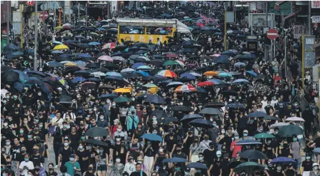  ?? AFP ?? Thousands of Hong Kong protesters faced arrest for taking part in the banned demonstrat­ion in the city’s Kowloon district