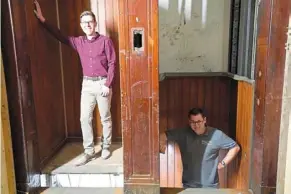  ?? — dpa ?? augenstein (left) and Wagner in the world’s oldest paternoste­r elevator in the Fluggerhau­s building in Hamburg harbour, Germany.