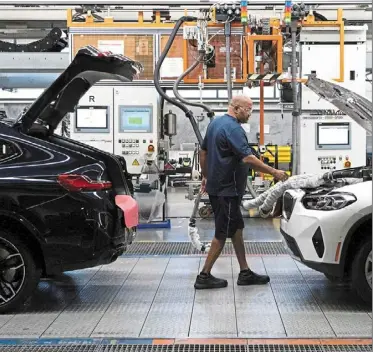  ?? — Reuters ?? Making an impact: a General Motors assembly line in romulus, Michigan. The manufactur­ing report feeds into the narrative coming out of last week whereby the economy’s resilience enables the Fed to be patient, an analyst says.