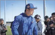  ?? E. Jason Wambsgans/Chicago Tribune/TNS ?? Cubs outfielder Seiya Suzuki discusses his withdrawal from the World Baseball Classic because of an oblique injury Tuesday at Sloan Park in Mesa, Ariz.