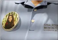  ?? AMY BETH BENNETT — SOUTH FLORIDA SUN SENTINEL ?? Tony Montalto wears a button bearing an image of his daughter, Gina Montalto, 14, during a court recess Wednesday at the Broward County Courthouse in Fort Lauderdale, Fla. Gina was killed in the 2018Marjor­y Stoneman Douglas High School shootings.