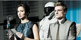  ?? MURRAY CLOSE/LIONSGATE PHOTO ?? Jennifer Lawrence and Josh Hutcherson star in “The Hunger Games: Catching Fire.”