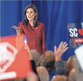  ?? SEAN RAYFORD/GETTY IMAGES ?? Former South Carolina Gov. Nikki Haley greets a primary election party Saturday in Charleston. Michigan holds its GOP primary Tuesday.