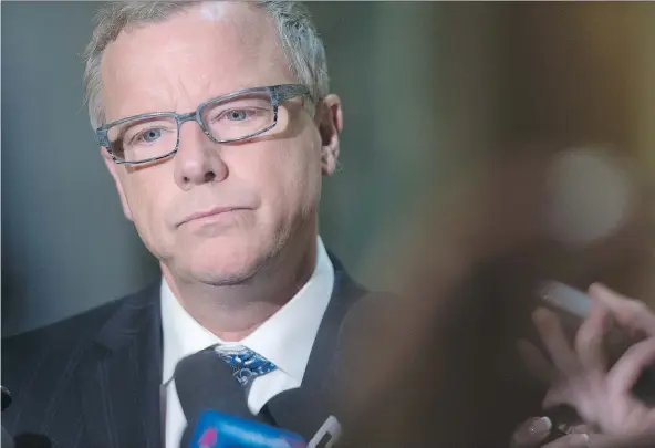  ?? PHOTOS: MICHAEL BELL ?? With critics slamming his government’s budget, Premier Brad Wall faced the most difficult legislativ­e session of his political career.