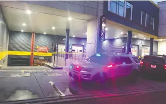  ?? BRENDAN MILLER/FILES ?? Police blocked off the parkade at Eau Claire Market as the homicide unit investigat­ed a fatal shooting in early June.