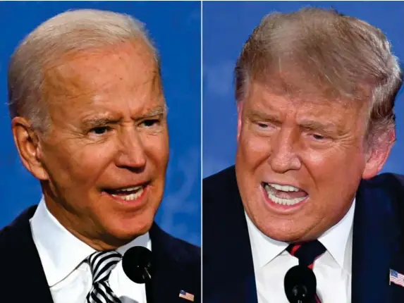  ?? (AFP/Getty) ?? Biden and Trump lock horns during the first presidenti­al debate