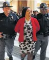  ?? John Bazemore / Associated Press ?? Georgia state Sen. Nikema Williams is arrested Tuesday by Capitol police during a protest over election ballots.