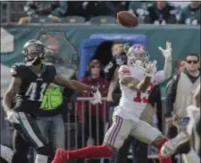  ?? JOHN BLAINE — 21ST-CENTURY MEDIA PHOTO ?? Giants receiver Odell Beckham Jr. catches a pass after getting past Eagles defensive back De’Vante Bausby (41) during Sunday’s game at Lincoln Financial Field.