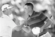  ?? ROSS D. FRANKLIN/ASSOCIATED PRESS ?? After winning a one-hole playoff, Gary Woodland, right, shakes hands with Chez Reavie on the 18th green Sunday.