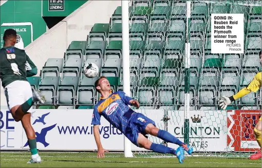  ?? PICTURES:
Pinnacle ?? GOING IN: Reuben Reid heads the Plymouth winner from close range