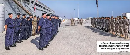  ?? MoD/PA Wire ?? > Qatari forces welcoming the mine warfare staff from RFA Cardigan Bay to Doha