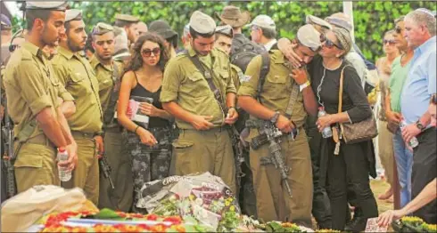  ?? PHOTO: FLASH 90 ?? The funeral of an Israeli soldier who died in the latest round of violence