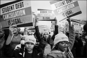  ?? KENT NISHIMURA / LOS ANGELES TIMES ?? People rally to show support for the Biden administra­tion’s student debt relief plan Feb. 28 in front of the Supreme Court of the United States in Washington, D.C. At a time when President Joe Biden’s plan to cancel up to $20,000 in debt for some borrowers is a nonstarter in Congress and at risk of being blocked by the Supreme Court, his administra­tion has tried to bolster the existing web of programs, policies and regulation­s meant to protect student loan borrowers.