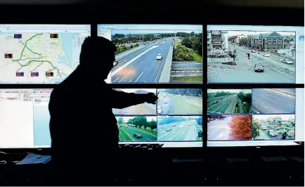  ?? PHOTO: STUFF ?? Christchur­ch Transport Operations Centre manager Ryan Cooney monitoring traffic when the control room opened in 2014.