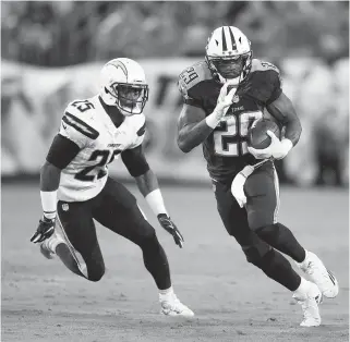  ?? ASSOCIATED PRESS FILE PHOTOS ?? Tennessee Titans running back DeMarco Murray runs past San Diego Chargers defensive back Darrell Stuckey during an Aug. 13 preseason game in Nashville. The Titans have not hid their plans at all in trying to turn around this franchise. Now it’s time to...