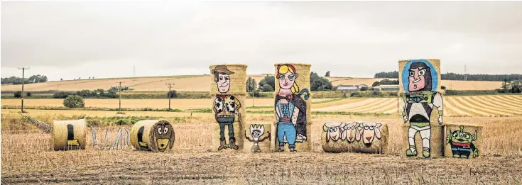  ?? Pictures: Kris Miller. ?? Hay bale artist Fleur Baxter’s latest creations to put a smile on the face of Angus motorists. Toy Story is the theme of this year’s artwork.