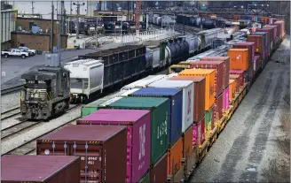  ?? GENE J. PUSKAR — THE ASSOCIATED PRESS FILE ?? Freight train cars and containers at Norfolk Southern Railroad’s Conway Yard in Conway, Pa. It wouldn’t take long for the effects of a rail strike to trickle through the economy. Many businesses only have a few days’ worth of raw materials and space for finished goods.