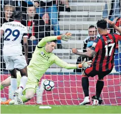  ??  ?? Late leveller: Joshua King slots home in the 89th minute to earn Bournemout­h a point