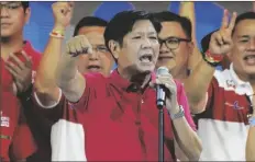  ?? AARON FAVILA/AP ?? PRESIDENTI­AL HOPEFUL, former senator Ferdinand “Bongbong” Marcos Jr., the son of the late dictator, gestures as he greets the crowd during a campaign rally in Quezon City, Philippine­s on April 13.