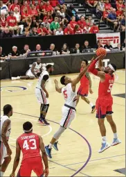  ?? DAVID JABLONSKI / STAFF ?? Devin Oliver, always a fan favorite, sinks a 3-pointer Friday, helping the Red Scare make the second round of The Basketball Tournament.