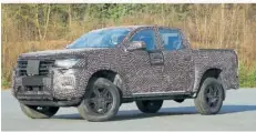  ?? FOTO: VOLKSWAGEN AG/DPA ?? Ganz zeigen will VW die neue Generation des Pick-ups Amarok noch im kommenden Sommer.