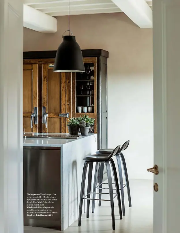  ??  ?? Dining room The vintage table is surrounded by ‘ Beetle’ chairs by Gubi (available at The Conran Shop). The ‘ Modo’ chandelier is from Roll & Hill Kitchen Gubi stools provide a spot to eat breakfast at the marble and stainless-steel island Stockist...