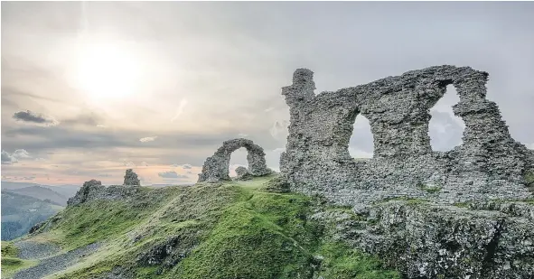  ?? — GETTY IMAGES FILES ?? Exploring Wales, you may come across Dinas Bran Castle, a medieval castle standing high above the town of Llangollen.