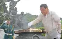  ?? AFP ?? Duterte burns incense at the National Cemetery in Seoul on Monday. He is in Seoul for a three-day visit to discuss ways to bolster economic and other cooperatio­n between the two countries. —