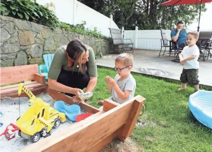  ?? TANIA SAVAYAN/USA TODAY NETWORK ?? Diane Segel plays with her son William, 3, who has special needs. She started a petition for New York to open an extended in-person summer school for kids with special needs.