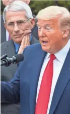  ?? ALEX BRANDON/AP ?? Dr. Anthony Fauci, director of the National Institute of Allergy and Infectious Diseases, listens to President Donald Trump discuss COVID-19 on March 13.