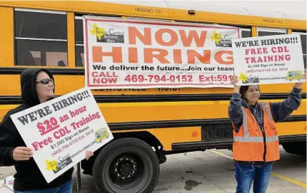  ?? Irwin Thompson/tribune News Service ?? With low unemployme­nt and record job openings in Texas, companies say they can’t find enough workers. Earlier this year, school bus drivers Salomae Arebalos, left, and Flo Lopez tried to recruit bus drivers and monitors in the Dallas area.