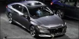  ?? AP PHOTO/CARLOS OSORIO ?? The 2018 Honda Accord is unveiled in Detroit Friday. The 10th-generation Accord features the world's first 10speed automatic transmissi­on for a front-drive car and a new generation of Honda's two-motor hybrid technology.