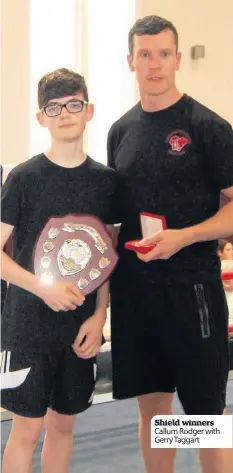  ??  ?? Shield winners Callum Rodger with Gerry Taggart