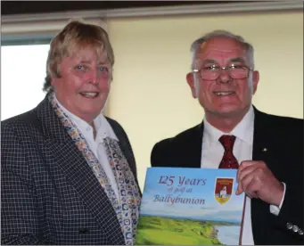  ??  ?? Mary McKenna M.B.E. and author Ivan Morris launch Ballybunio­n’s 125-year history