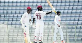  ?? COURTESY OF WIPLAYERS.COM ?? West Indies ‘A’ opener Kirk McKenzie raises his bat in celebratio­n of a half century on the opening day of a first-class cricket match against Bangladesh ‘A’ at the Sylhet Internatio­nal Cricket Stadium in Bangladesh yesterday.