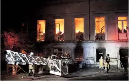  ??  ?? A fire on Sunday ripped through Rio de Janeiro’s National Museum (top) as firefighte­rs try to extinguish the blaze(above). The museum has collected more than 20 million items, including archeologi­cal finds and historical items. — Xinhua