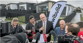  ?? PETER MEECHAM/ STUFF ?? Housing Minister Phil Twyford talks about the process around Kiwibuild in Papakura where the first affordable homes have been built.