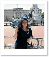  ??  ?? Emma standing outside Buckingham Palace during a garden party.