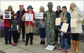  ??  ?? NO LAUGHING MATTER: Protestors, with ‘Charlie Chaplin’ at the Waterville Women’s March.