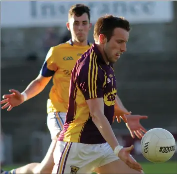  ??  ?? Wing-back Robbie Barron on a burst upfield as Longford’s Shane Kenny looks on.