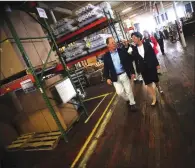 ?? Ernest A. Brown photo ?? Max Brickle, President of H. Brickle and Son, Inc., left, gives Gov. Gina Raimondo a tour of his facility in Woonsocket.