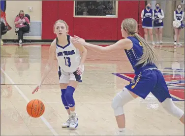  ?? Wes Taylor/Special to the News-Times ?? In the backcourt: Freshman Bella Frisby dribbles the ball up the floor during the 2A State Tournament. The Lady Trojans hope to continue their success despite losing a talented senior class this season.