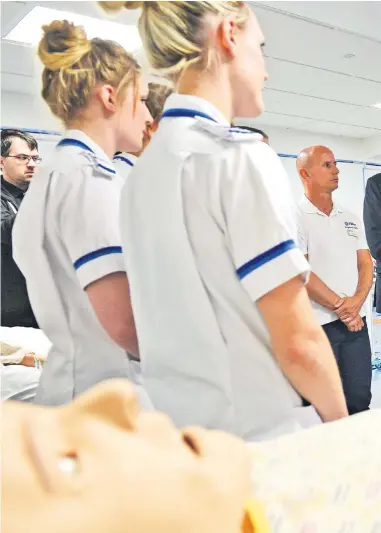  ??  ?? Stiff task: Mr Corbyn visited the University of Worcester Nursing School yesterday