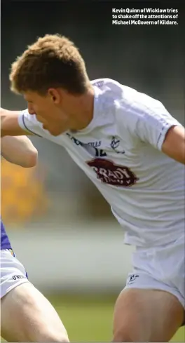  ??  ?? Kevin Quinn of Wicklow tries to shake off the attentions of Michael McGovern of Kildare.