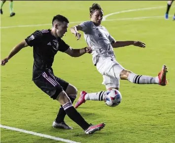  ?? MATIAS J. OCNER mocner@miamiheral­d.com ?? Inter Miami midfielder Lewis Morgan, left, kicks toward the goal as Montreal midfielder Lassi Lappalaine­n defends during the first half on Wednesday night. For the Montreal-Inter Miami late result, go to miamherald.com.