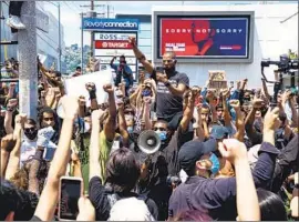  ?? Kent Nishimura Los Angeles Times ?? A BLACK LIVES MATTER demonstrat­ion in L.A.’s Fairfax district. Mayor Eric Garcetti has been criticized both by people in the movement and its foes.