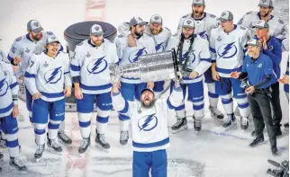  ?? PERRY NELSON • USA TODAY SPORTS ?? Tampa Bay Lightning defenceman Zach Bogosian hoists the Stanley Cup after defeating the Dallas Stars in Game 6 of the 2020 Stanley Cup final in Edmonton on Sept. 28.