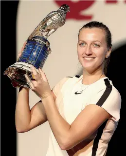  ?? AFP ?? Petra Kvitova of the Czech Republic poses with her trophy after winning women’s singles final at the Qatar Open tennis tournament in Doha on Sunday. —