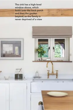  ??  ?? The sink has a high-level window above, which looks onto the back porch and then the garden beyond, so the family is never deprived of a view