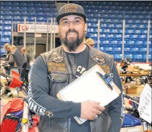  ?? KATIE SMITH/THE GUARDIAN ?? Mark Gauthier, president of the Vicious Cycle Motorcycle Club, is shown at the Eastlink Centre in Charlottet­own on the long weekend for the annual motorcycle swap meet.